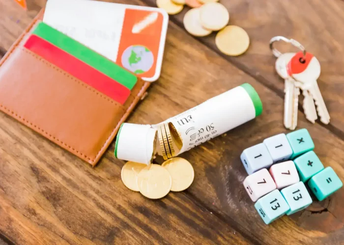 broken-wrapper-with-euro-coins-near-math-blocks-key